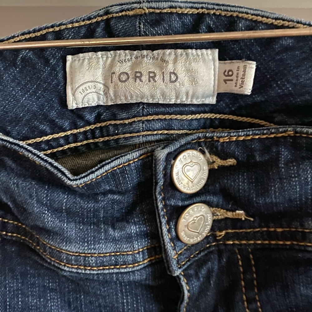 Torrid Jeans with fraying on bottom.